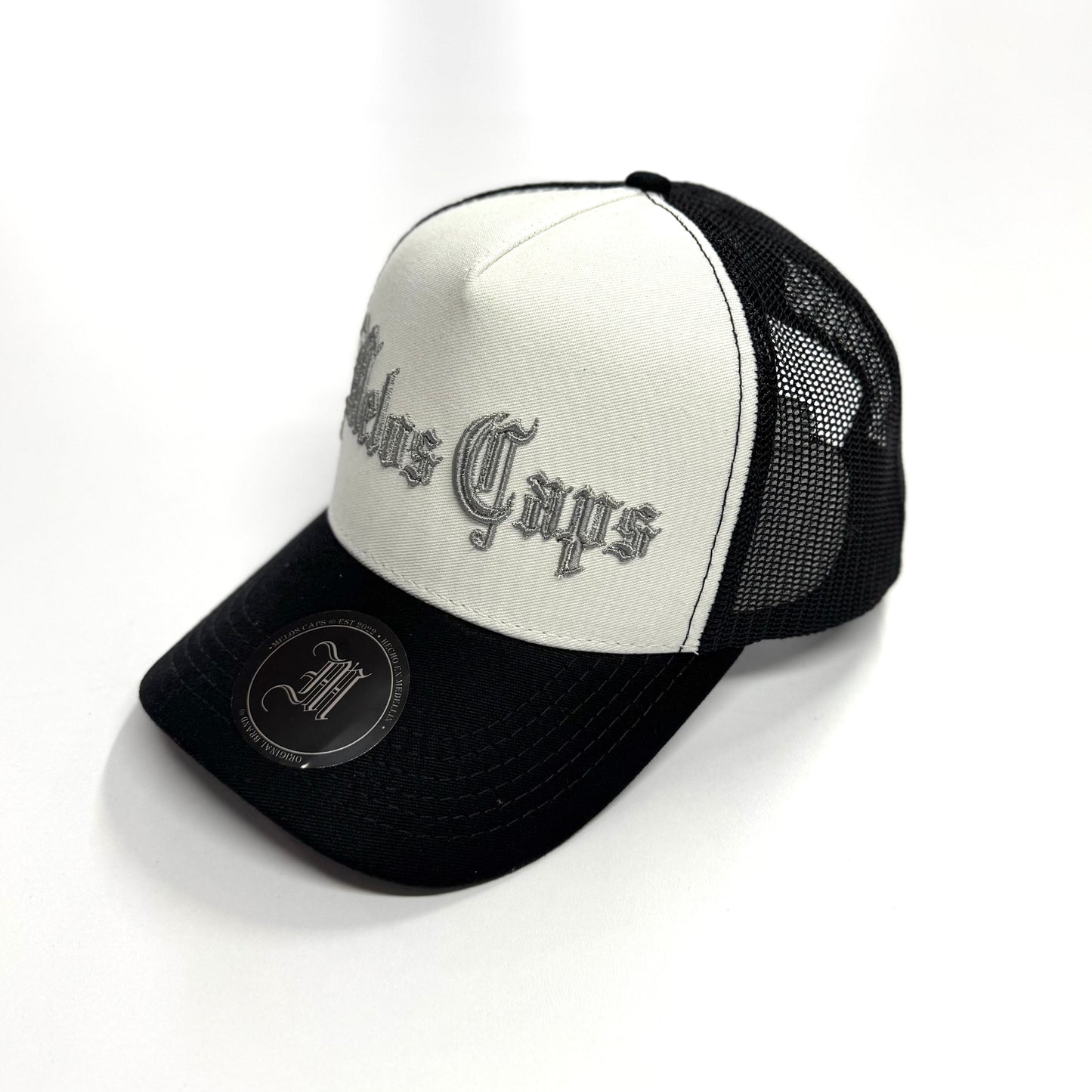 GORRA TRUCKER MELOS CAPS BLANCO Y NEGRO